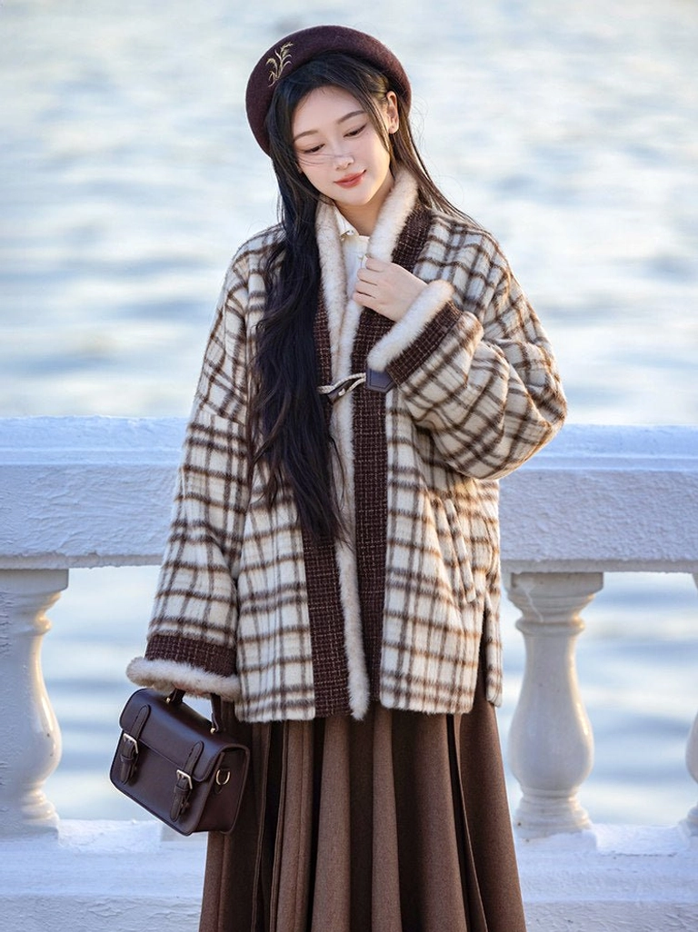 Waist-up view of modern hanfu winter coat showing soft faux fur trim and vintage leather handbag styling