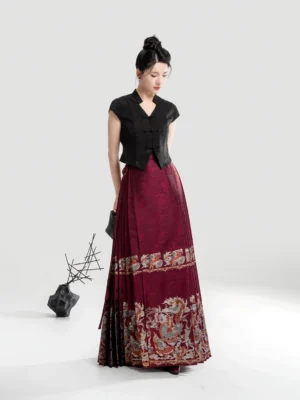 Modern Hanfu women's black V-neck cropped top paired with a red dragon-patterned jacquard mamian skirt in a side three-quarter fashion studio view
