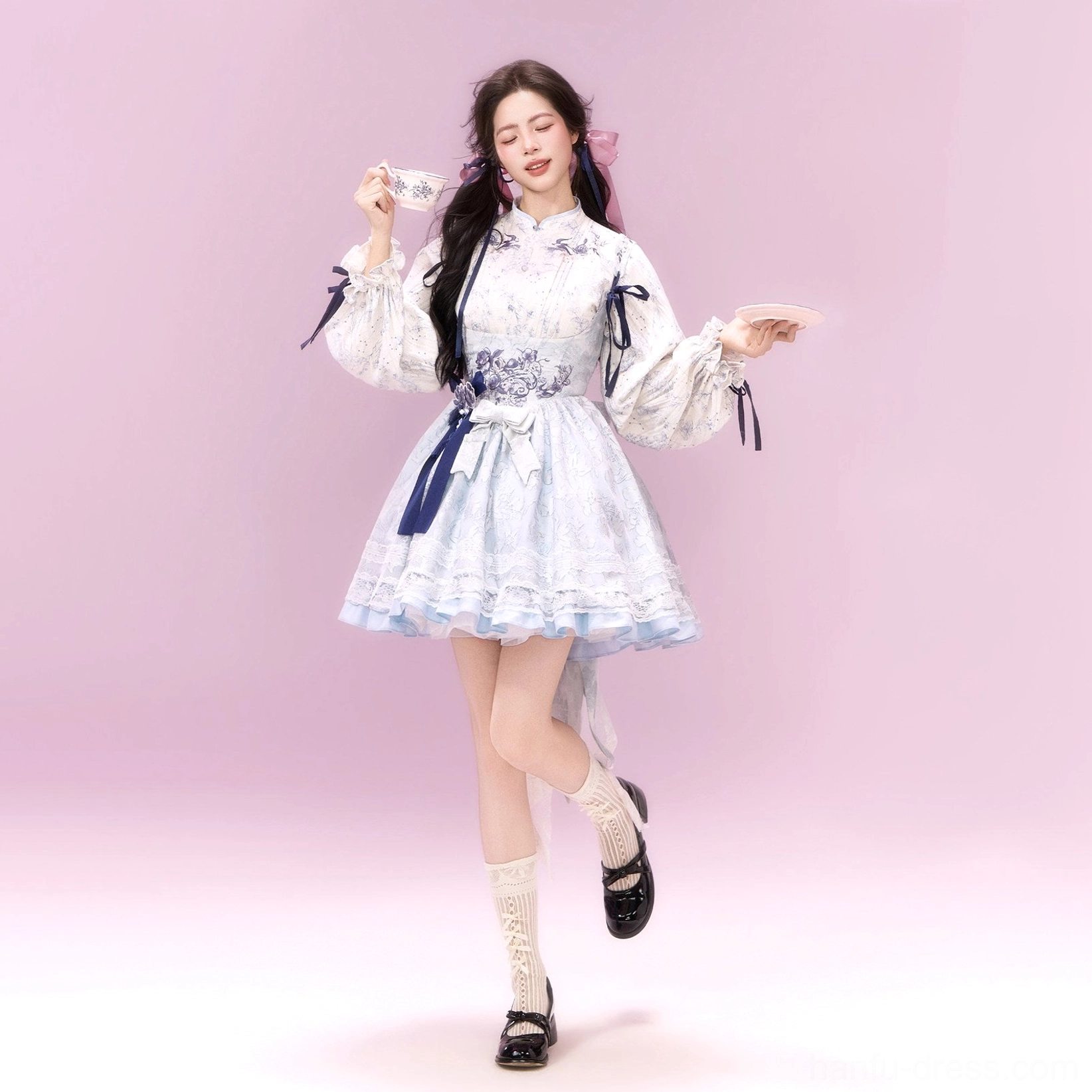 Light blue and sweet pink modern Hanfu xianxia Lolita dress set product styling with floral blouse, layered ruffle skirt, ribbons, and waist embroidery
