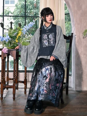 Side sitting view of a modern Ming Dynasty-style Hanfu outfit featuring an indigo embroidered bijia vest and luminous black mamian skirt