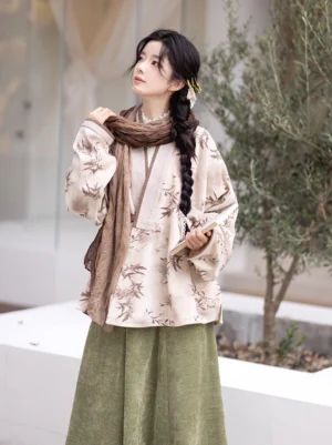 Front view of a modern Ming Dynasty Hanfu set featuring a beige bamboo printed cross-collar winged sleeve top and olive green long skirt