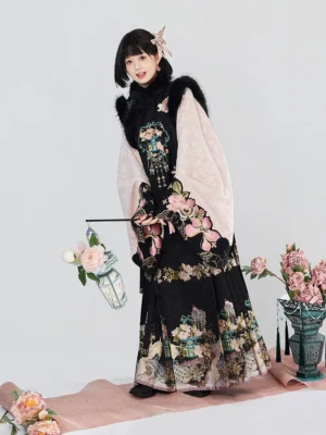 Modern Ming Dynasty Hanfu outfit showing embroidered black vest floral pipa sleeve top and patterned mamianqun horse-face skirt