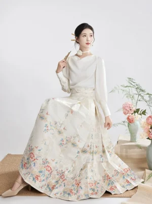 Modern Ming Dynasty Hanfu mamianqun horse face skirt set in snow white with floral and bird print, pleated skirt, and elegant boat neck top