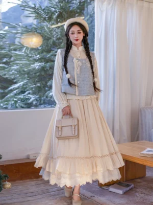 Full front view of a modern Ming Dynasty Hanfu vest and layered skirt set in sea salt blue and magnolia ivory, styled with a floral embroidered vest, lace hem skirt, beret, and vintage handbag
