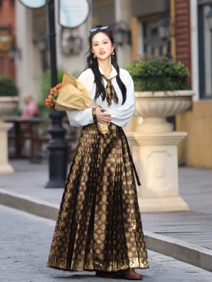 Modern Ming style mamianqun Hanfu outfit with white top matching patterned necktie and dark brown gold floral pleated skirt on a European street