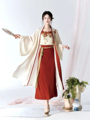 Full-body front view of a modern Song Dynasty camellia Hanfu three-piece set with cream cardigan, floral camisole, and burgundy wrap skirt
