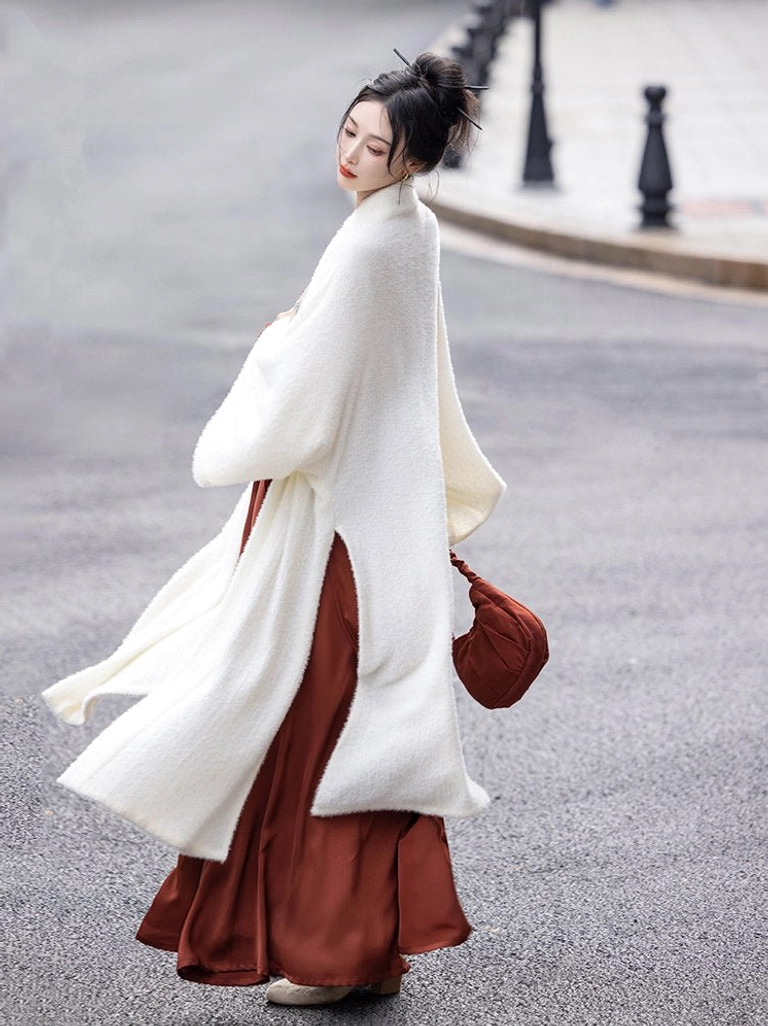 Rear view of a flowing modern Song Dynasty Hanfu set walking outdoors, showing the drape of the oversized ivory beizi jacket and long two-tone burgundy skirt