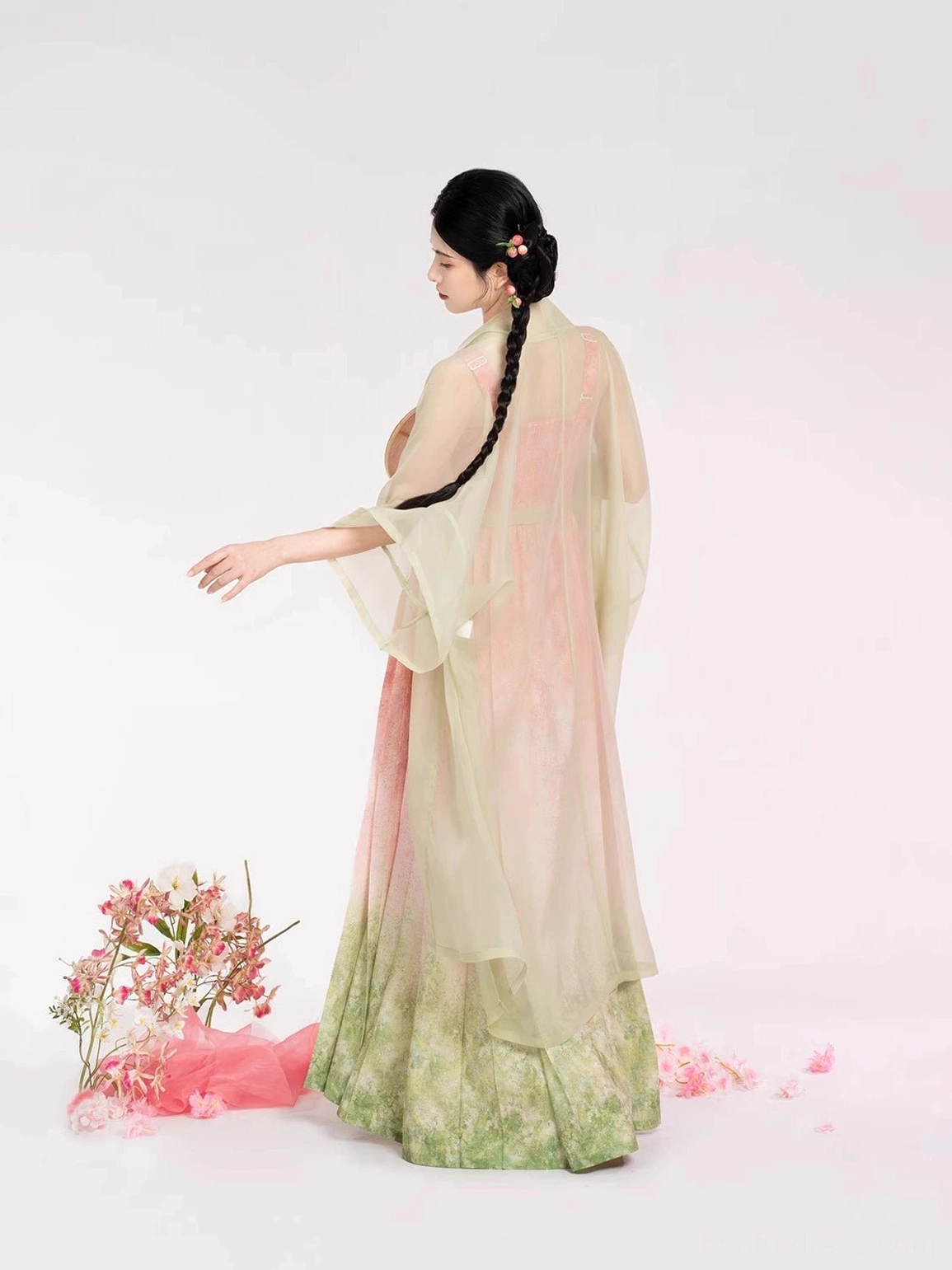 Side-back view showing the relaxed flowing silhouette and full-length shape of a modern Song Dynasty Hanfu beizi jacket and gradient slip dress