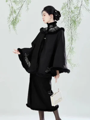 Black modern Song Dynasty Hanfu embroidered cape and wrap skirt shown in left profile with silver floral embroidery and plush-look trim