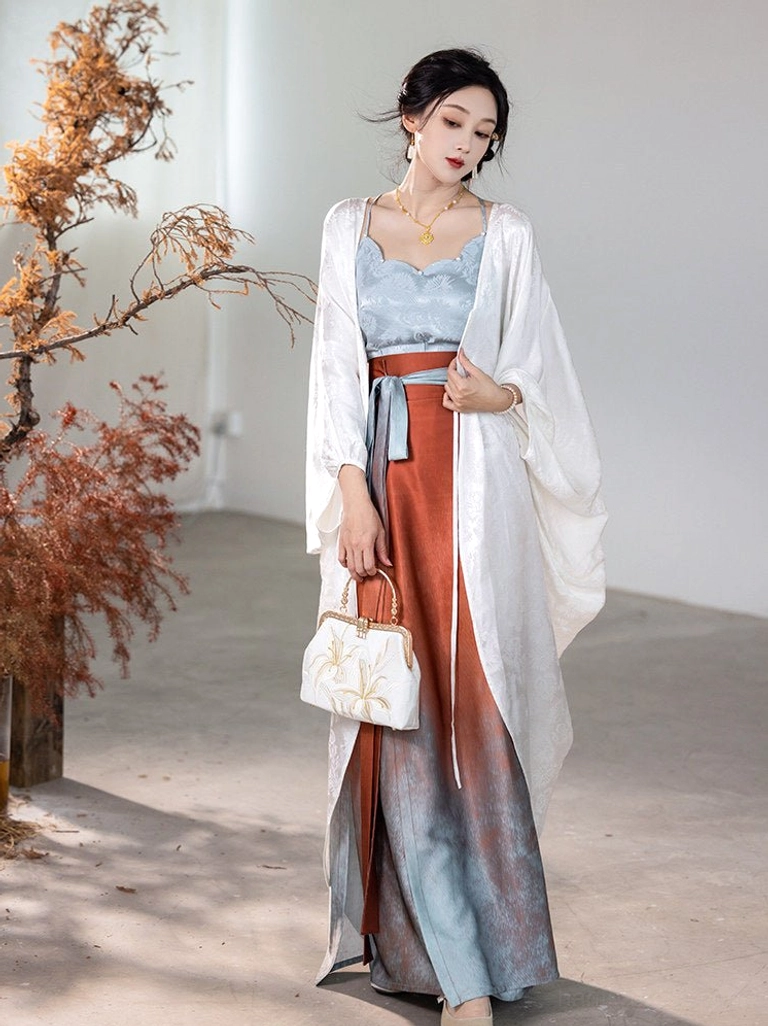 Modern Song Dynasty Hanfu fairy outfit featuring a light blue scalloped camisole, flowing ivory cardigan, and ombre spiral wrap skirt
