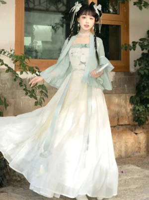 Side view of modern Song Dynasty-inspired Hanfu outfit with mint green cardigan flowing floor-length skirt waist sash and windblown hem