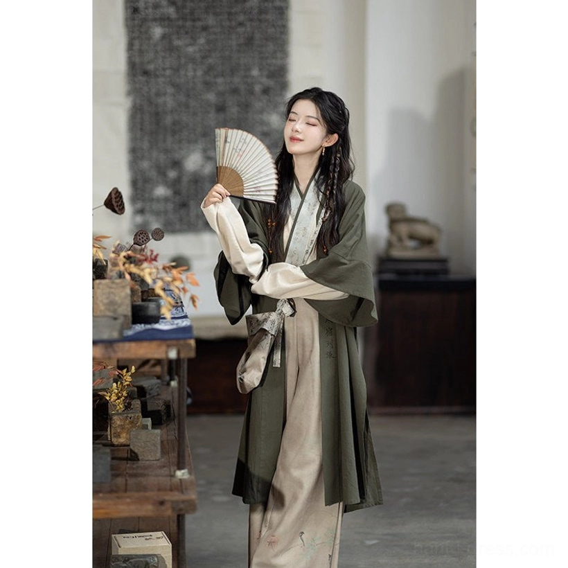 Modern Song Dynasty Hanfu full layered outfit with olive cardigan crane print pants and folding fan close-up