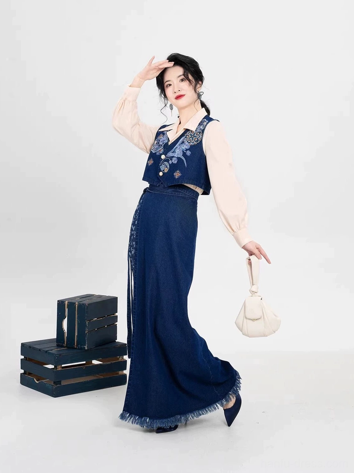 Dynamic side view of modern Song Dynasty Hanfu full set featuring embroidered navy vest and flowing long wrap skirt