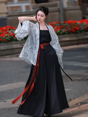 Modern Song Dynasty Hanfu full set styled outdoors with a light gray leaf-print wide-sleeved jacket, black camisole, flowing wide-leg trousers, and red waist sash