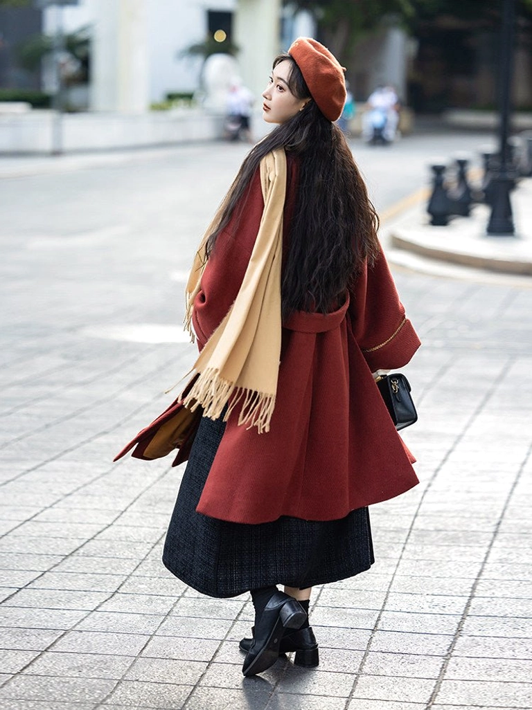 Three-quarter back view of modern Song Dynasty Hanfu outfit with brick red ginkgo jacket tied waist and dark wrap skirt