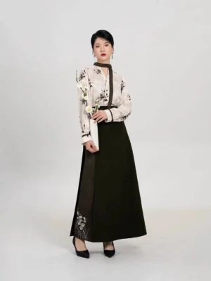 Modern Song Dynasty Hanfu two-piece set with ivory ink plum long sleeve top and dark olive spiral skirt styled with a plum blossom branch