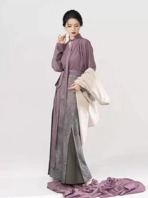 Modern Song Dynasty Hanfu outfit with dusty purple tie-neck top and grey floral pleated skirt styled with ivory outer jacket