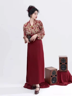 Modern Song Dynasty Hanfu set in wine red with gold floral winged-sleeve top and long deep red wrap skirt