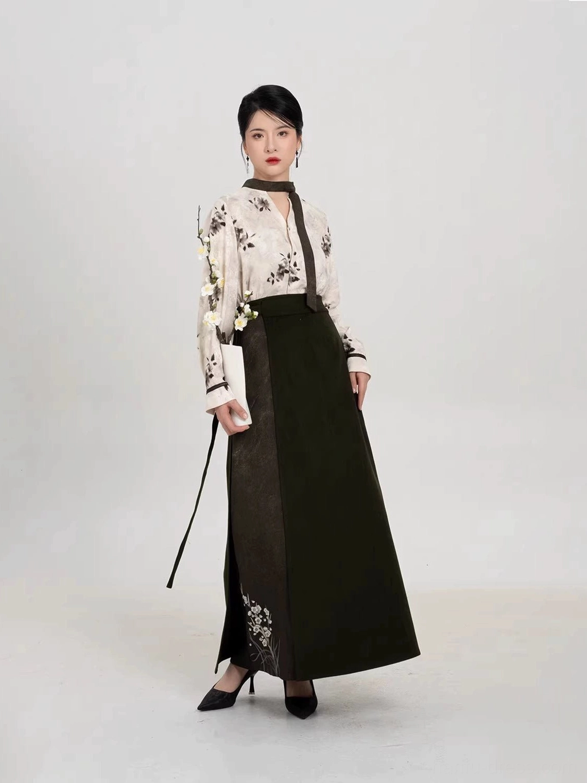 Side view of modern Song Dynasty Hanfu set showing the flowing skirt side slit and detachable dark necktie