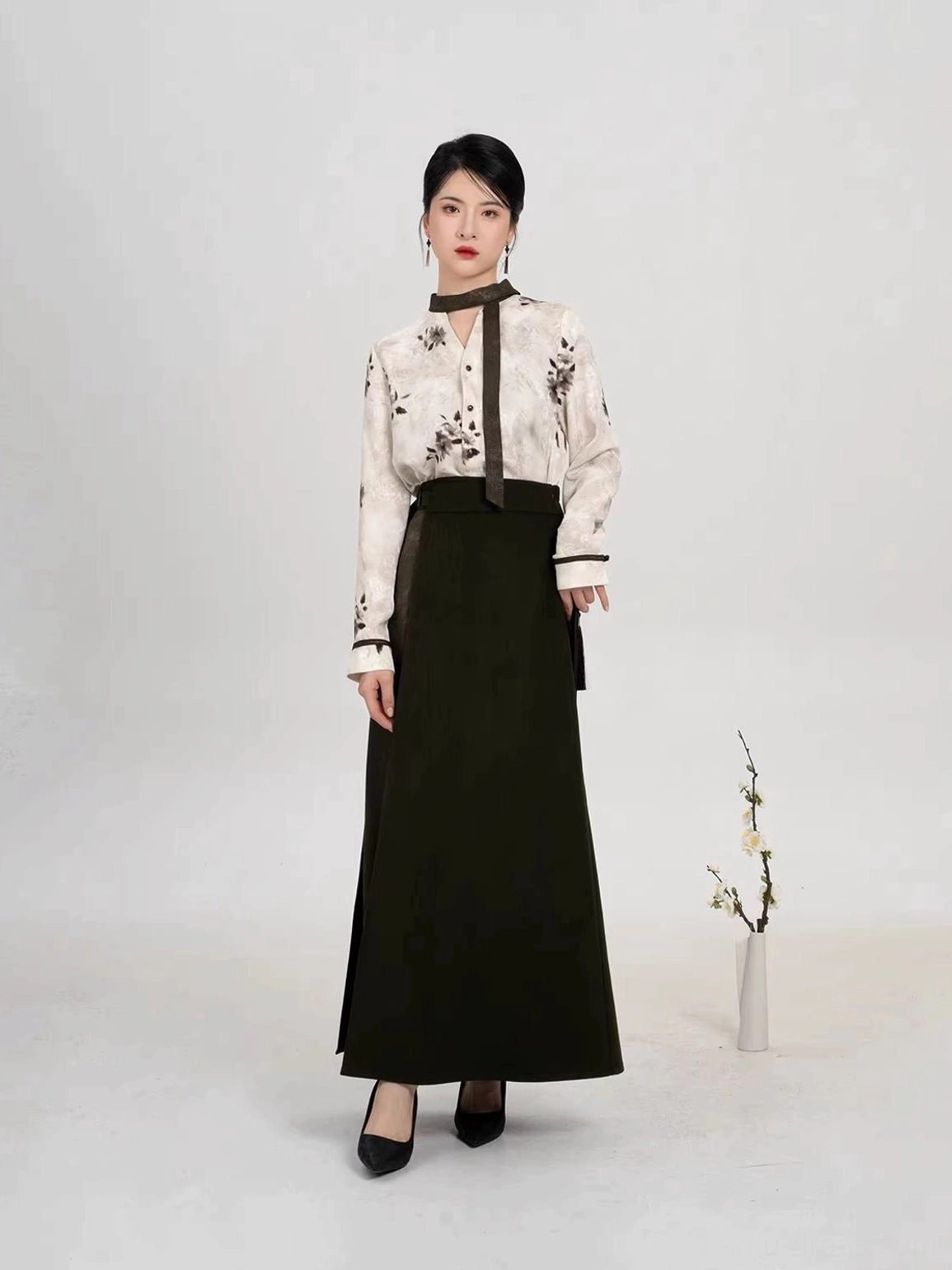 Modern Song Dynasty Hanfu outfit with stand-up contrast collar, long sleeves, cuff trim, and elegant ivory plum blossom print