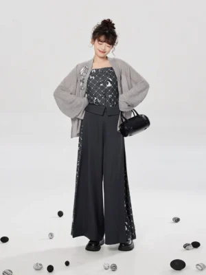 Full-body front view of a modern Song Dynasty Hanfu three-piece set with grey embroidered knit jacket, crane print camisole, and wide-leg pants