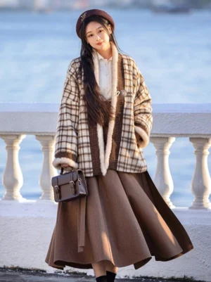 Modern Song Dynasty hanfu winter outfit with plaid jacket and wrap skirt styled beside a scenic waterfront balustrade