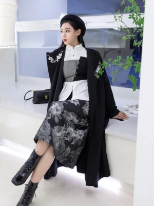 Modern Song Dynasty inspired Hanfu outfit with white stand collar shirt, black floral embroidered coat, grey rose print midi wrap skirt, beret, combat boots, and handbag