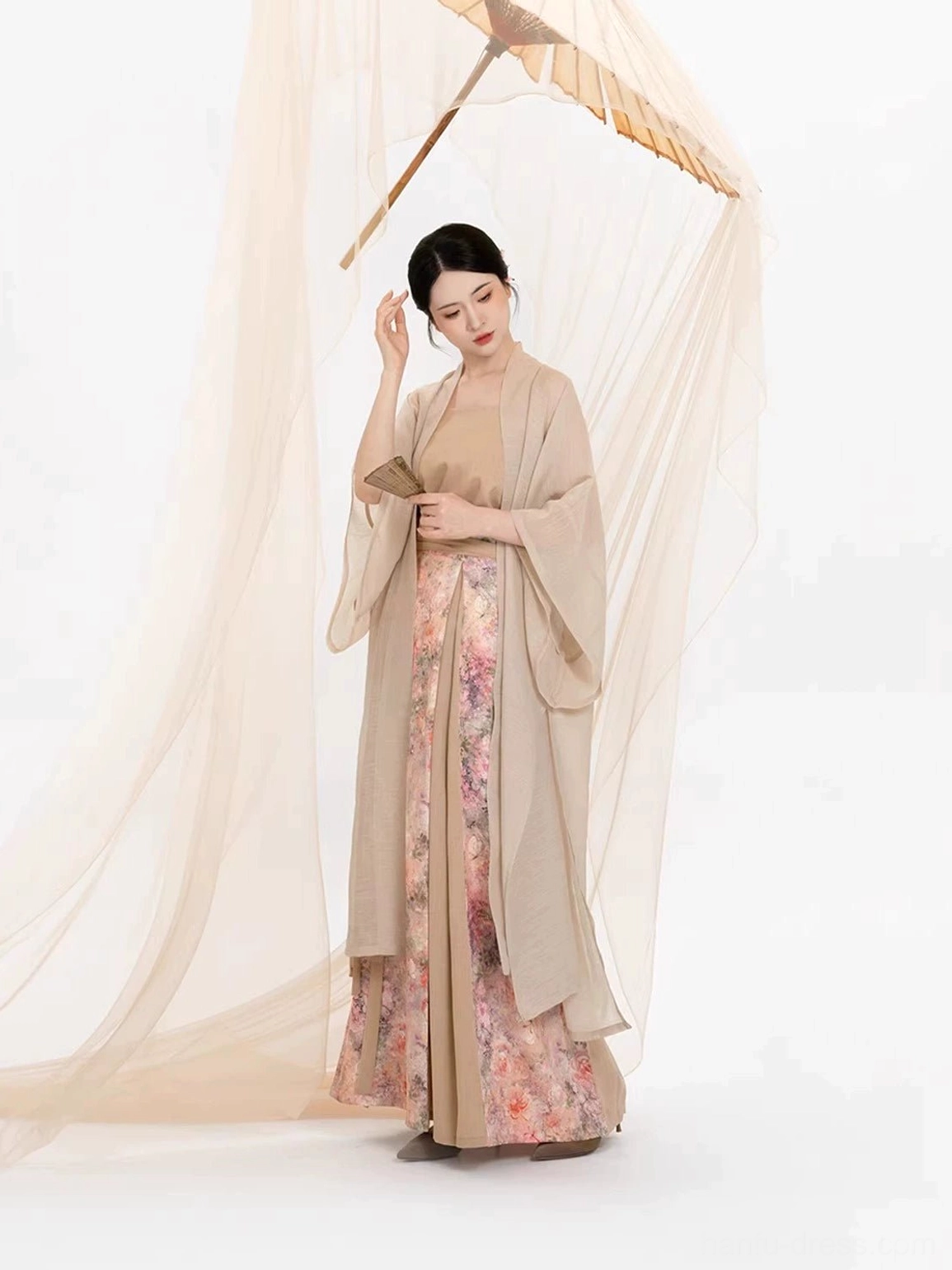 Modern Song Dynasty inspired Hanfu three-piece set with soft beige outer jacket and romantic watercolor floral skirt