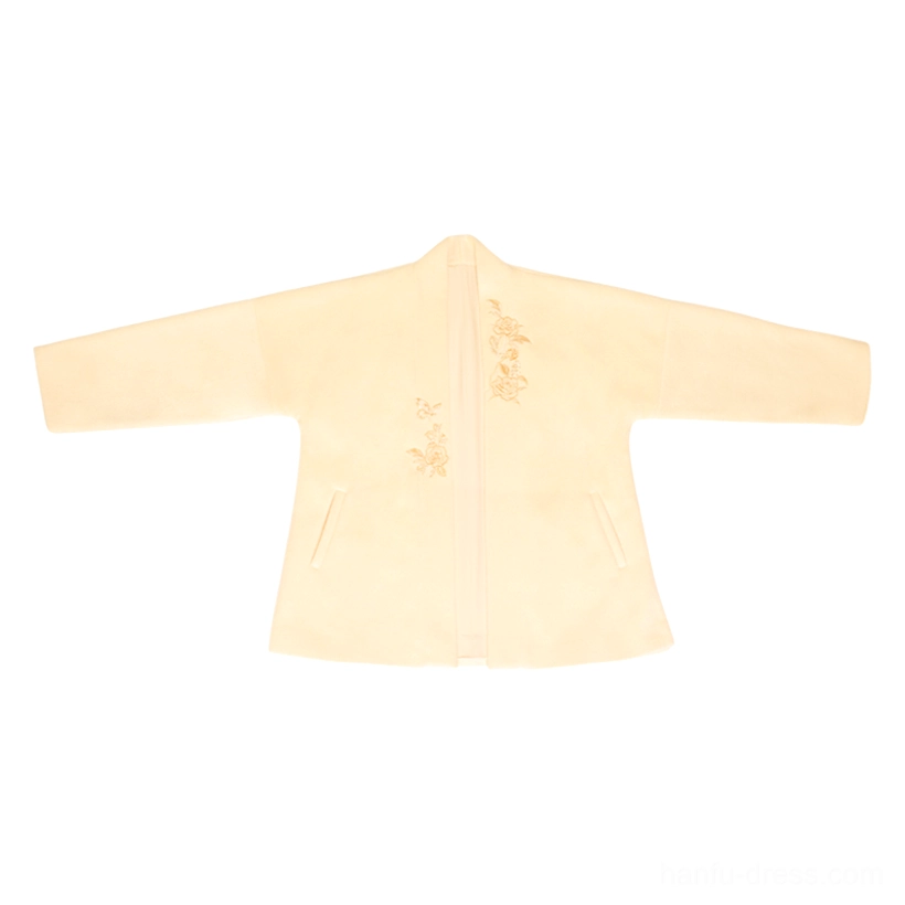Flat lay of the cream modern Song Hanfu outer jacket showing open front construction, wool blend texture, and subtle floral chest embroidery
