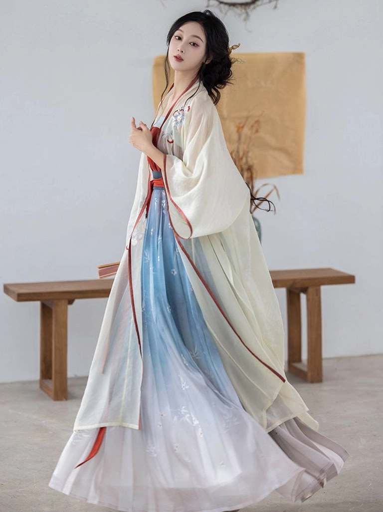 Full front view of a modern Song style Hanfu outfit with flowing cream wide sleeve cardigan, burgundy camisole, and pleated gradient skirt