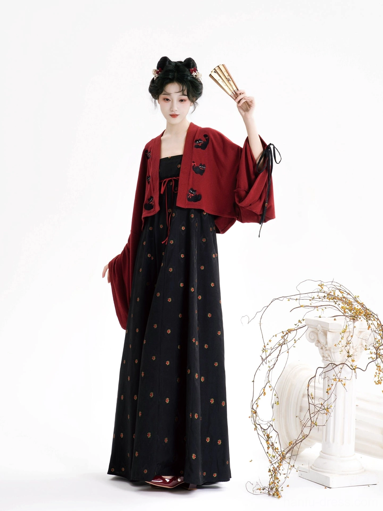 Modern Tang Dynasty Hanfu outfit with black floral long slip dress burgundy cropped cardigan and folding fans front view