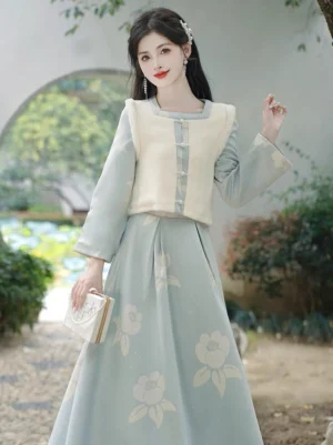 Modern Tang Dynasty Hanfu dress set shown in a classical Chinese garden with floral print skirt and textured ivory vest