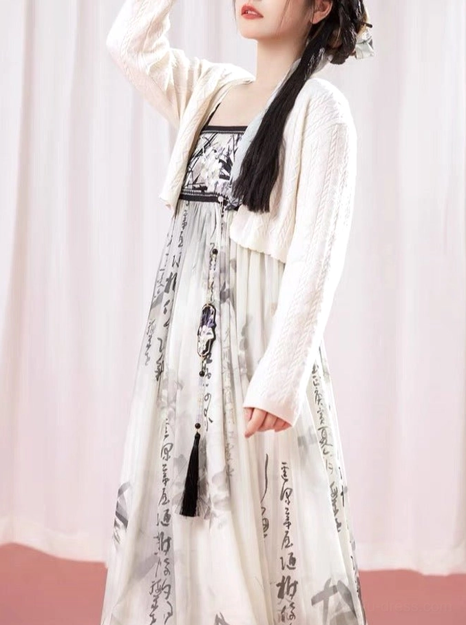 Female model wearing Chinese ink wash Hanfu dress with floral landscape bust print cream knit cardigan and tassel pendant
