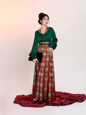 Three-quarter front view of an elegant Tang Dynasty Hanfu outfit featuring an emerald satin blouse, long lantern sleeves, printed wrap skirt, and modern cultural fashion styling