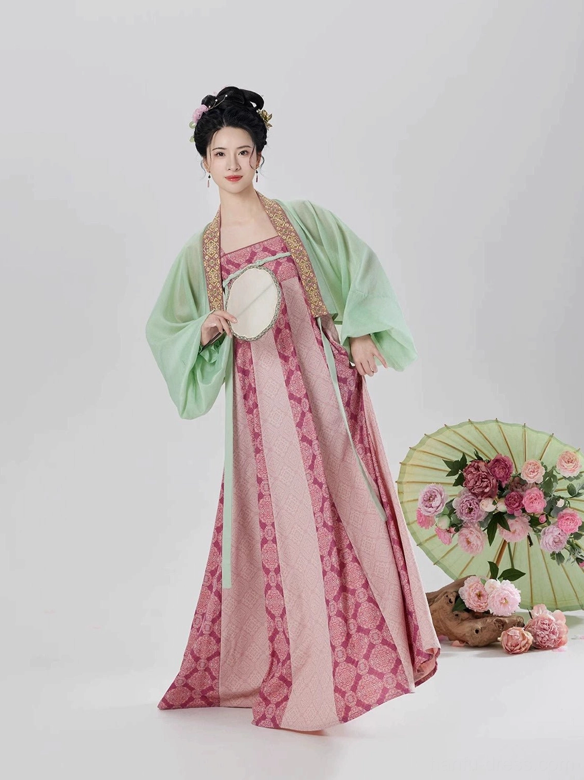 Modern Tang Dynasty Hanfu slip dress and sheer cardigan styled with a round silk fan showing the neckline and golden trim