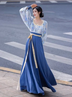 Modern Tang Dynasty Hanfu two piece outfit with Van Gogh inspired blue watercolor top lantern sleeves navy wrap skirt and beige waist sash shown from the front