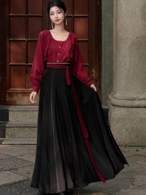 Modern Tang Dynasty Hanfu outfit with wine red sweetheart collar blouse, black flowing wrap skirt, and red waist sash shown in a full body street style view
