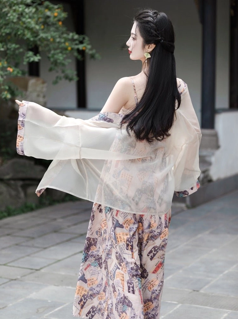 Back view of modern Tang style hanfu dress set showing the airy sheer cardigan, wide draping sleeves and flowing printed maxi skirt