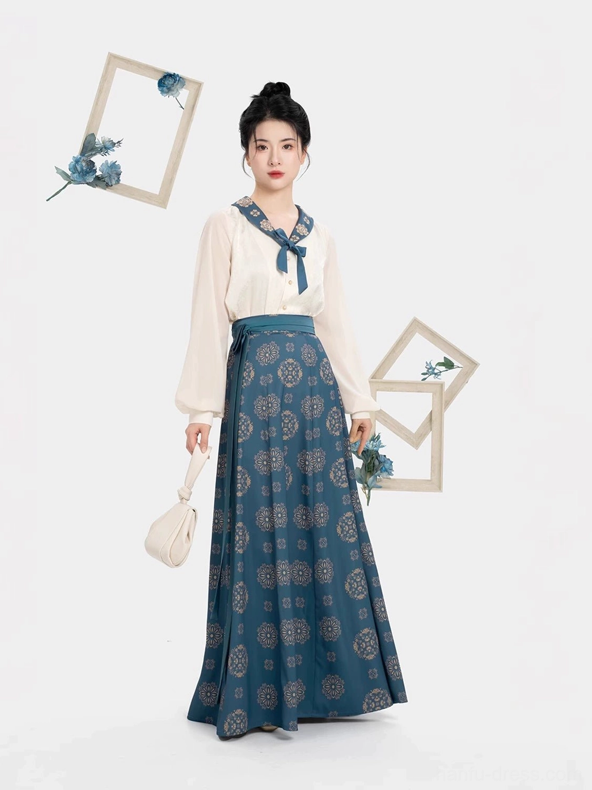 Side view of a modern Tang-style hanfu set showing airy long lantern sleeves, elegant cream top, floor-length dailan navy nine-panel skirt, and graceful drape