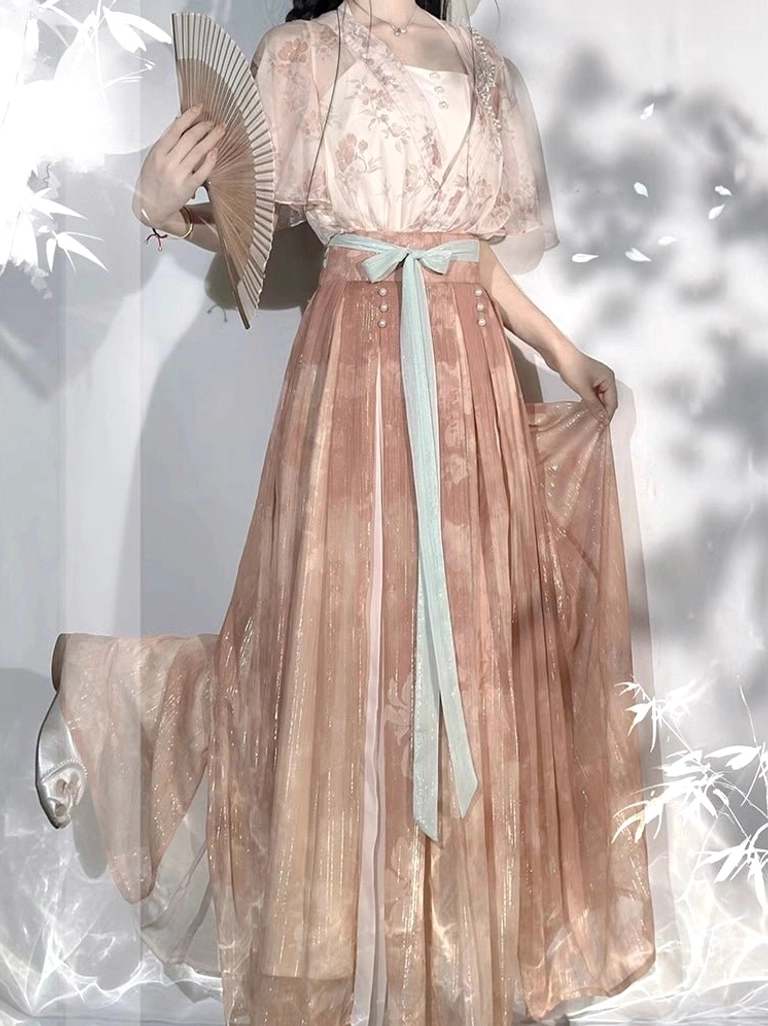 Back three quarter view of a modern Wei-Jin style Hanfu set with sheer floral outer coat square neckline shimmering skirt and long light blue waist sash