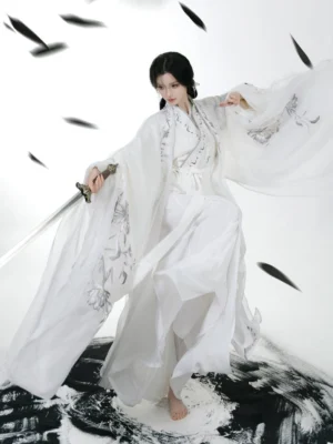 Moon Fox Wei Jin Dynasty embroidered Qiyao Ruqun Hanfu in white with flowing sheer sleeves and silver embroidery, modeled with a traditional Chinese sword