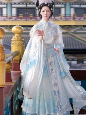 Front view of Moon Goddess Wei Jin Dynasty embroidered Qiyao Ruqun Hanfu in ivory and pale blue with wide ruffled sleeves and traditional floral embroidery