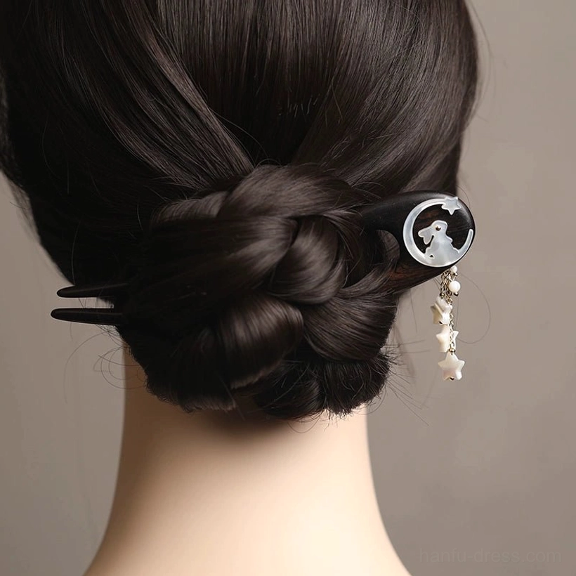 Back view showing a Moon Rabbit Chinese hair stick securing a braided chignon, with the Hanfu tassel hanging beside the bun