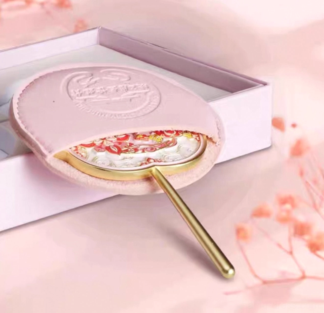 Moonlit lotus Chinese hand mirror displayed with a pink protective storage pouch and gift box for elegant Hanfu inspired gifting
