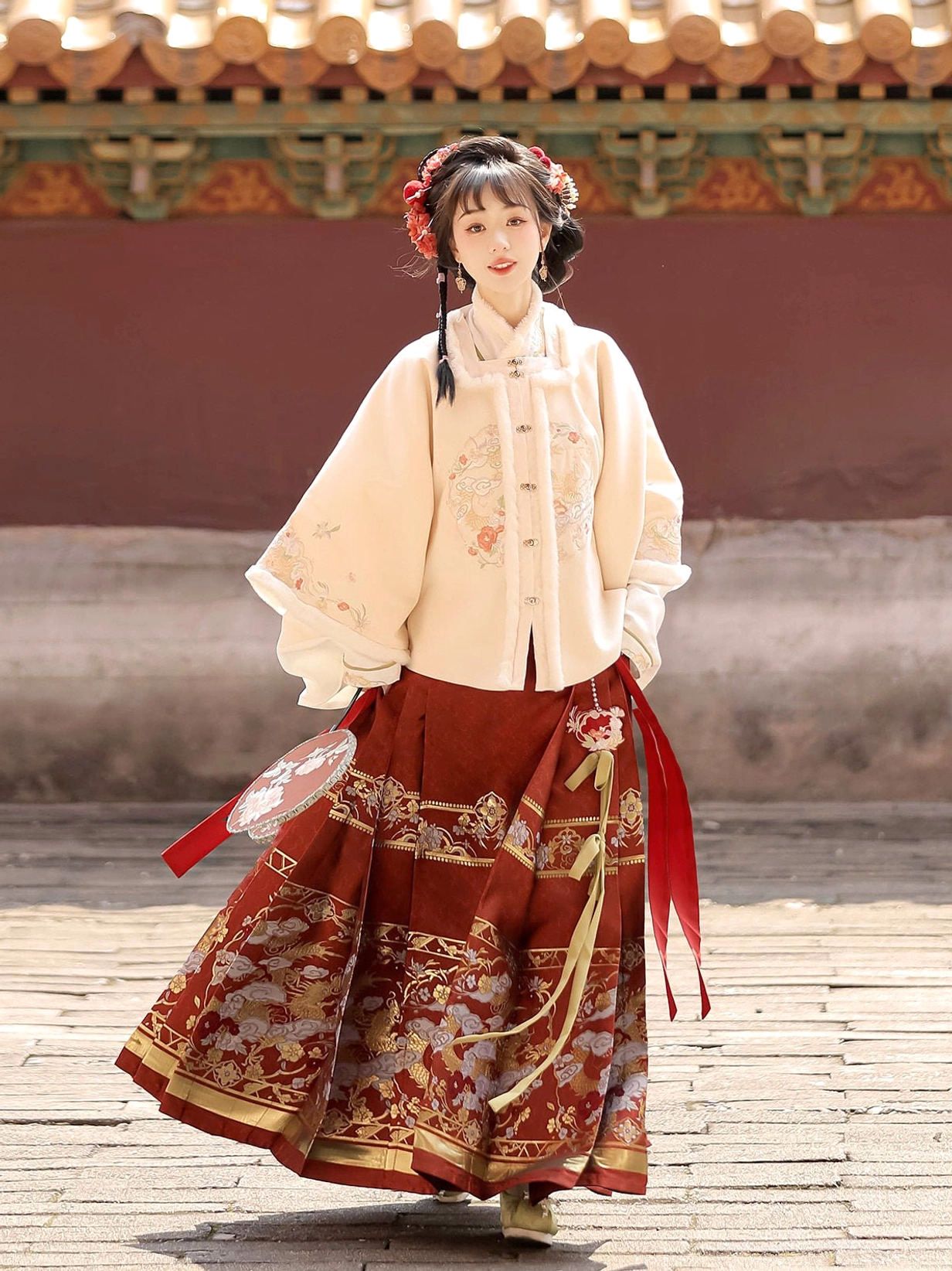 Side view of Moonlit Night Ming dynasty Hanfu Chinese New Year dress with cream floral jacket red mamian skirt and round silk fan