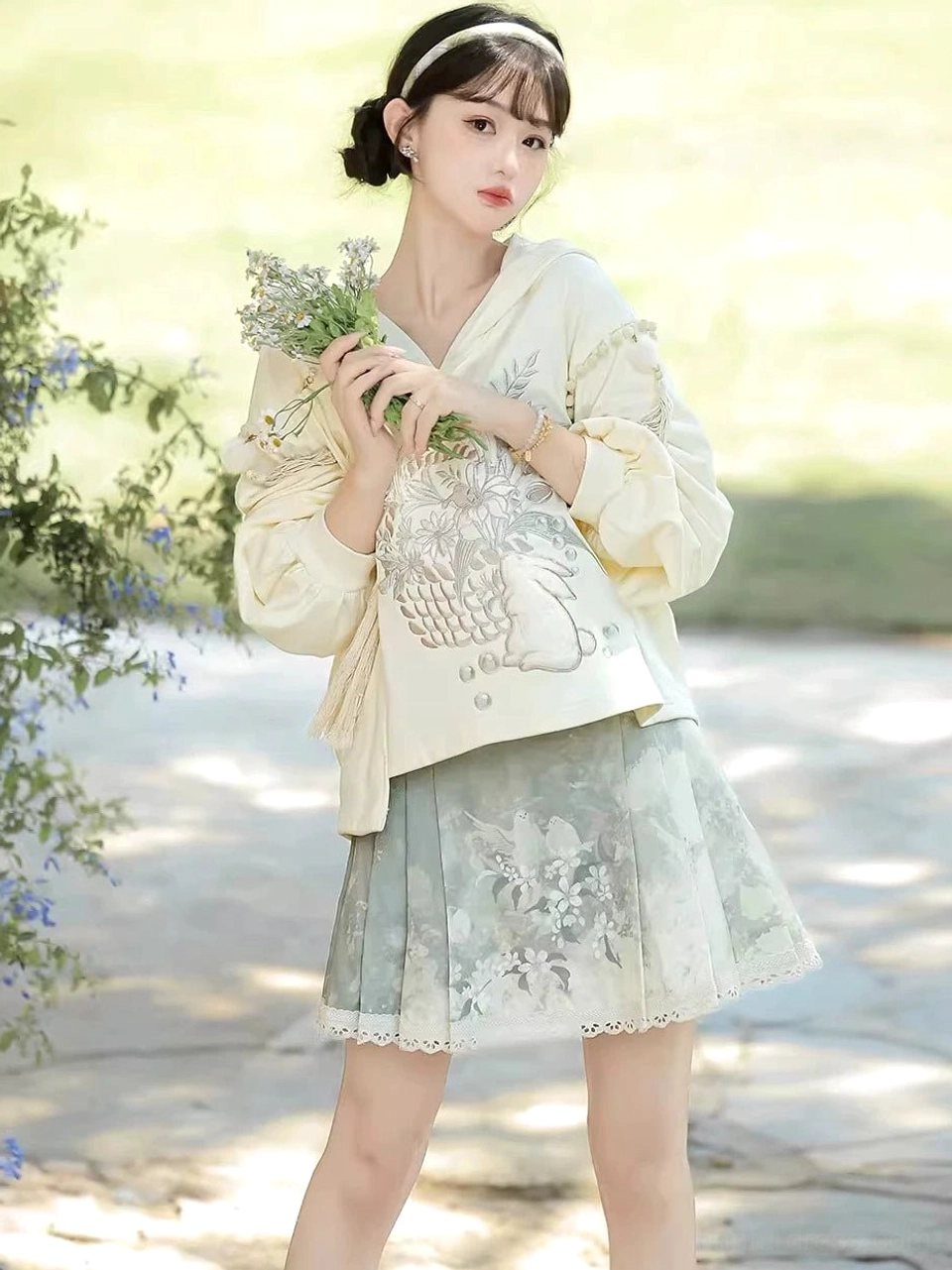 Morning Garden Hanfu daily wear set displaying floral fruit embroidery and tassel details on the cream hooded blouse