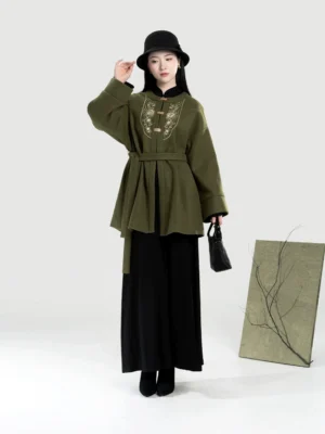 Front view of moss green modern Hanfu cardigan with gold chest embroidery, stand collar, flared sleeves, waist sash, and contemporary layered styling