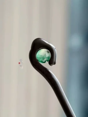 Mountain Spirit black wood Chinese hair stick close-up with green marbled stone accent and curved cloud-inspired head