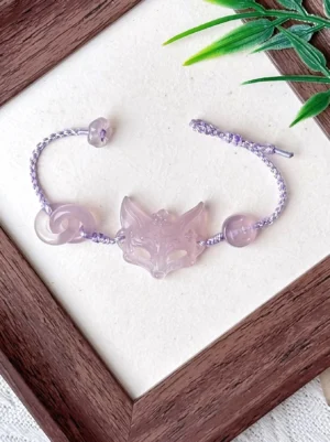 Natural agate fox spirit Chinese bracelet with pale lilac hand-braided adjustable cord, agate bead and double-loop stone ornaments displayed in wooden frame