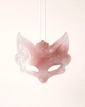Close-up of a natural agate fox spirit pendant for a Chinese necklace, showing translucent pink and ivory tones, delicate carved floral details, and a smooth polished surface on a light pink background
